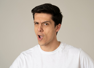 Obraz premium Portrait of young handsome cheerful man with smiling happy face. Human expressions and emotions