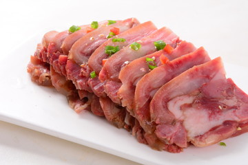 raw meat on a plate isolated on white