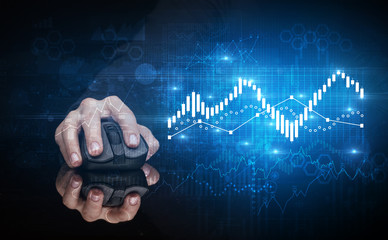 Hand using wireless mouse with statistical concept on dark background
