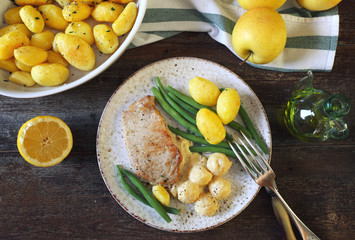 French cuisine: fried pork with Norman apple sauce, green beans and fried potatoes