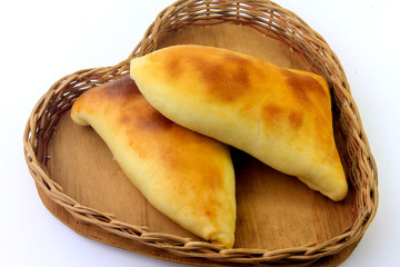 meat sfiha (esfiha) of arabic origin traditionally adapted for brazilian cuisine in the basket on white background