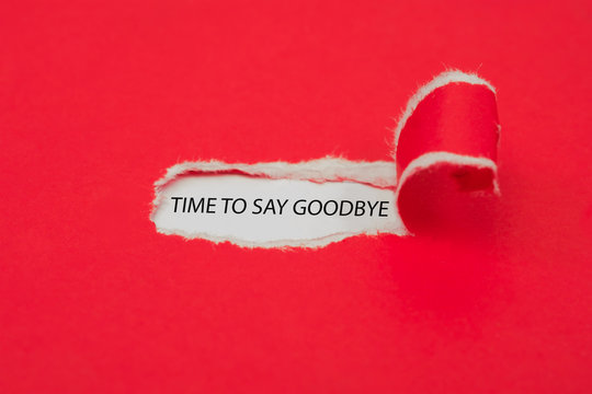 Torn red paper revealing the word Time to say goodbye. Business concept.