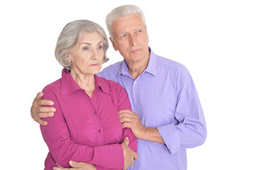 Portrait of sad senior couple isolated on white background