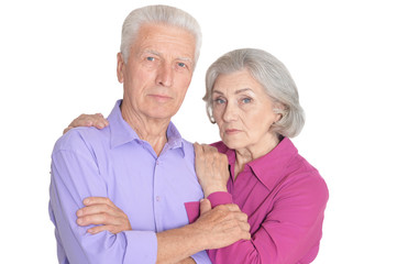 Close up portrait of sad senior couple isolated on white background