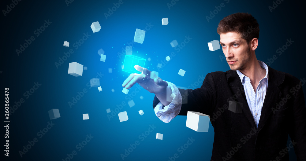 Aufkleber Man touching hologram screen displaying cube symbols
