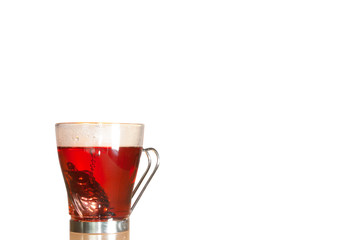 Teapot resting at the bottom of a transparent cup to release the essence of Jamaica flower in Mexico City healthy natural diuretic in Mexico City