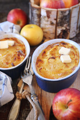Apple clafoutis in two ceramic dish for sweet breakfast and apples