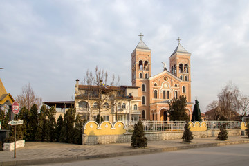 Fototapeta premium Sunset view of The Roman Catholic church of St Michael the Archangel in town of Rakovski, Bulgaria