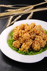 fried chicken with rice and vegetables on plate