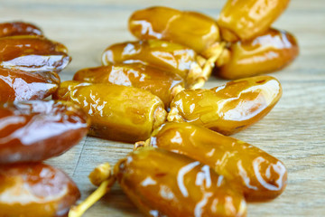 Sweet arabic algerian dates fruits on a wooden floor