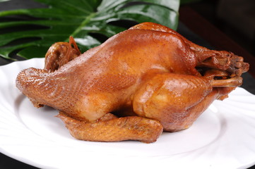 roasted chicken on a plate isolated on white