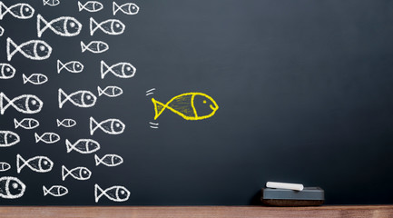 The concept of leadership. Big fish leads to a herd of fish