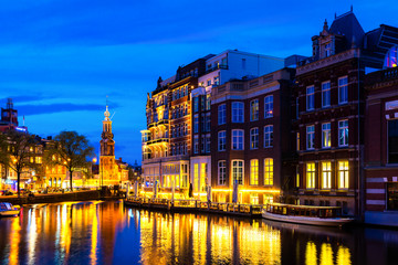Night city view of Amsterdam, the Netherlands with Amstel river.
