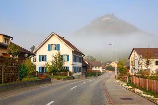 Residential neighborhood on a foggy autumn morning. Villigen, Switzerland.