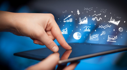 Hand holding tablet with online business report concept
