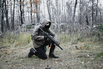 Stalker, a soldier guy in uniform and with a gun sits sideways