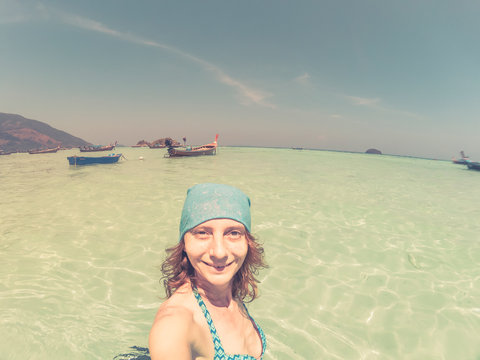 woman taking a selfie on a beach  in Thailand