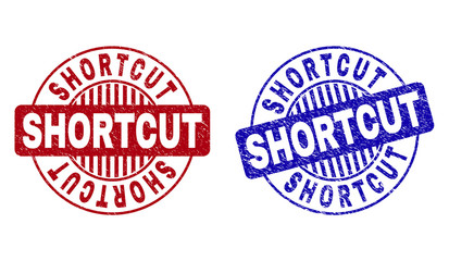 Grunge SHORTCUT round stamp seals isolated on a white background. Round seals with grunge texture in red and blue colors. Vector rubber overlay of SHORTCUT title inside circle form with stripes.