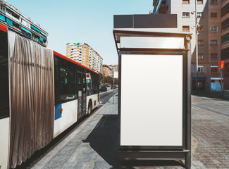 An empty ad poster mock-up on an outer side of the bus stop; advertising billboard placeholder...