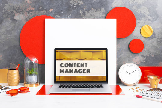 Computer staying on a table & showing the screen. Trendy & vibrant design. Geometry. Innovational digital internet applications & web business solutions. Modern workspace in an office. Development.