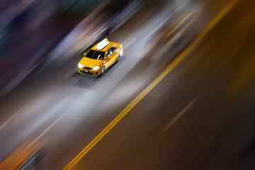 Overhead view of New York City taxi with blurred background