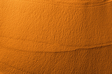 top view of textured sand with color filter and copy space