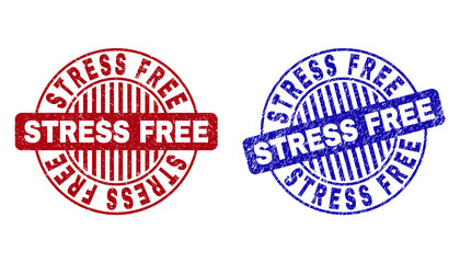 Grunge STRESS FREE round stamp seals isolated on a white background. Round seals with grunge texture in red and blue colors. Vector rubber overlay of STRESS FREE tag inside circle form with stripes.