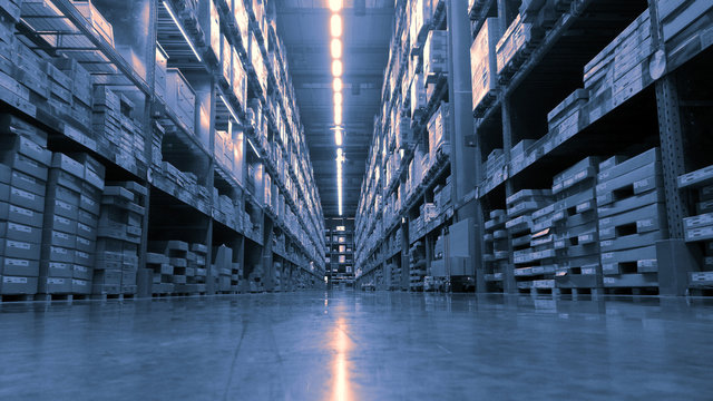 Huge product warehouse with tall shelves and lots of boxes stack over each other and bright led lights from top ceiling. Color tone adjusted