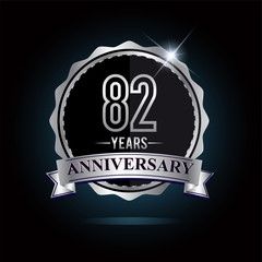 82nd anniversary logo with ribbon and silver shiny badge, vector design for birthday celebration