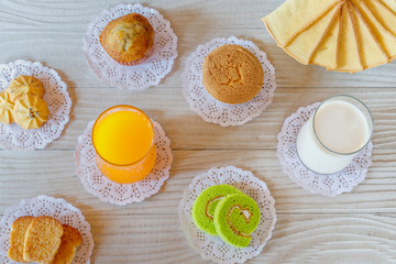 Orange Juice , Milk , Cupcake , Cake Roll , Garlic Bread , Butter Bread , Banana Cupcake and Cookie