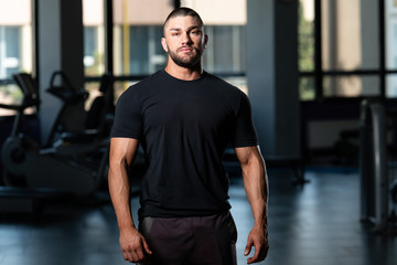 Muscular Man Posing In Black T-shirt