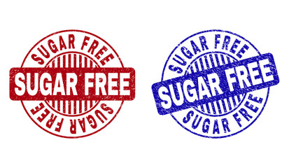 Grunge SUGAR FREE round stamp seals isolated on a white background. Round seals with grunge texture in red and blue colors. Vector rubber watermark of SUGAR FREE label inside circle form with stripes.