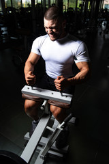 Handsome Man Exercising Calves In Fitness Center