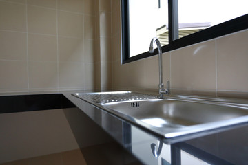 water faucet closed and stainless sink cooking in kitchen room