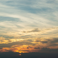 sunlight through cloud on dramatic sunset sky