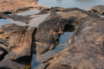 Fototapeta na wymiar Water trapped in a rocky gorge