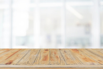 Empty wood table top and blurred bokeh restaurant interior background - can used for display or montage your products.
