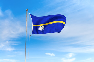 Nauru flag over blue sky background