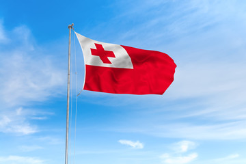 Tonga flag over blue sky background