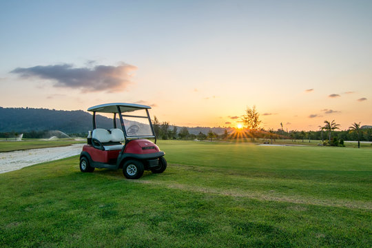The golf course landscape with beautiful sky. Golf cart at the green golf course