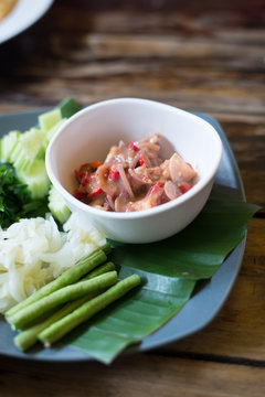 soft focus thai food nam prik goong siab on wood table