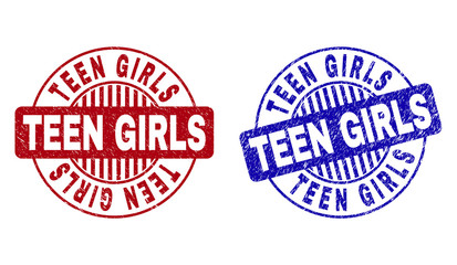 Grunge TEEN GIRLS round stamp seals isolated on a white background. Round seals with grunge texture in red and blue colors. Vector rubber imprint of TEEN GIRLS text inside circle form with stripes.