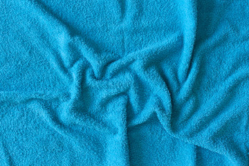 Top view of Blue Towel texture. Blue Towel Fabric Texture Background. Close-up. Blue  natural cotton towel background.Space for text. Hygiene, fabric, laundry,spa and textile concept.