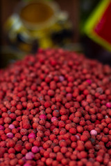 Red pepper peas in the oriental bazaar closeup. Eastern spices mountain - fermented pickled red peas. Oriental spices and fragrant spices in the oriental bazaar.