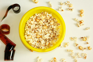Tasty salted popcorn in bowl on white background. Flat lay of pop corn bowl. Top view. Pop corn-Close up