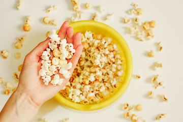 Fototapeta na wymiar Tasty salted popcorn in bowl on white background. Flat lay of pop corn bowl. Top view. Pop corn-Close up