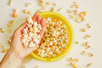 Tasty salted popcorn in bowl on white background. Flat lay of pop corn bowl. Top view. Pop corn-Close up