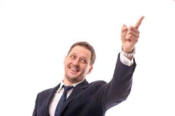 Studio shot of a young man businessman wearing   dark blue jacket proves something by showing his index finger.