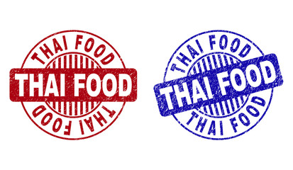 Grunge THAI FOOD round stamp seals isolated on a white background. Round seals with grunge texture in red and blue colors. Vector rubber imitation of THAI FOOD caption inside circle form with stripes.