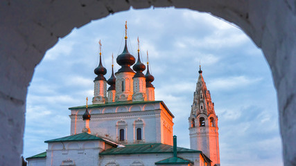 Sunset. View through the arch of the Alexander Church, Kostroma, Russia